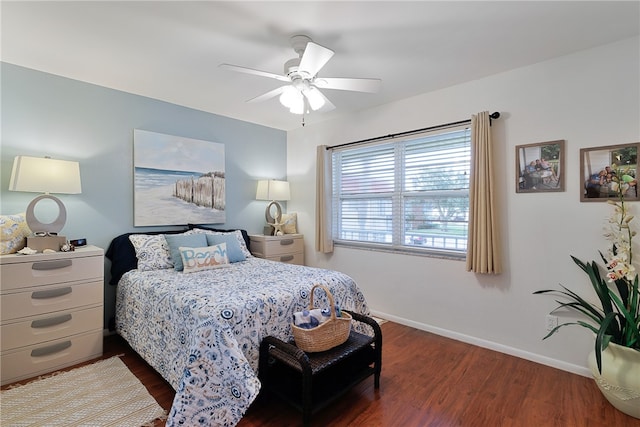 bedroom with ceiling fan and dark hardwood / wood-style floors