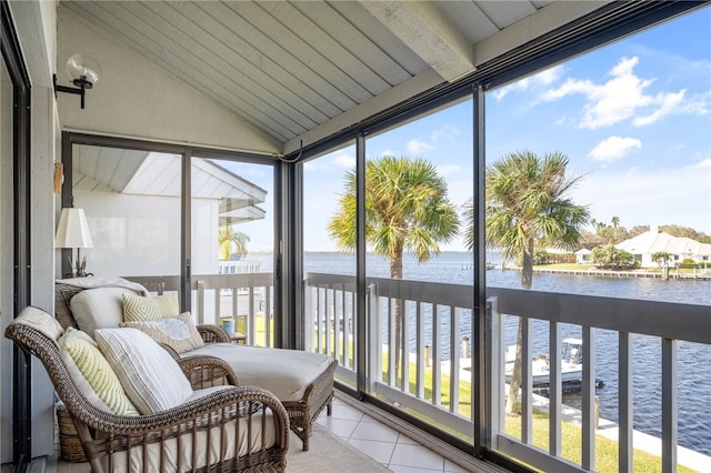 sunroom / solarium featuring wooden ceiling, lofted ceiling, a water view, and a healthy amount of sunlight