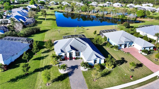 birds eye view of property with a residential view and a water view