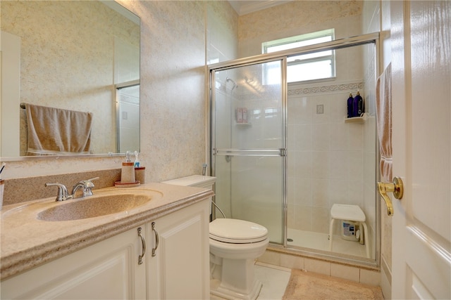 bathroom featuring vanity, a shower with door, tile patterned flooring, and toilet