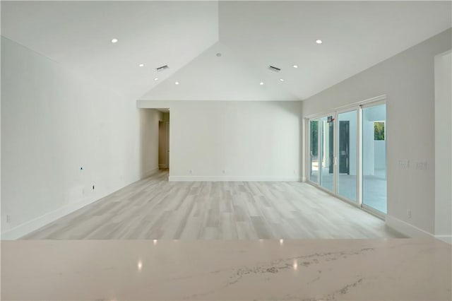 985 Clipper Rd, Vero Beach, FL 32963 - empty room featuring light wood-type flooring, vaulted ceiling, and recessed lighting