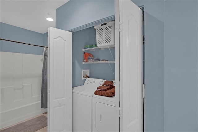 laundry area with washing machine and clothes dryer