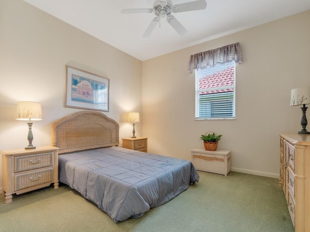 bedroom featuring baseboards, a ceiling fan, and carpet floors