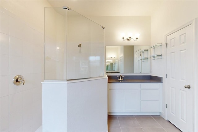 2545 Saint Lucia Cir, Vero Beach, FL 32967 - bathroom featuring a walk in shower, tile patterned floors, and vanity