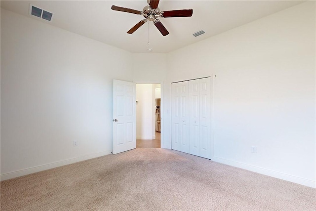 2545 Saint Lucia Cir, Vero Beach, FL 32967 - unfurnished room featuring light colored carpet, a ceiling fan, and baseboards