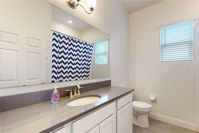 2545 Saint Lucia Cir, Vero Beach, FL 32967 - bathroom featuring toilet, vanity, tile patterned flooring, baseboards, and a shower with shower curtain