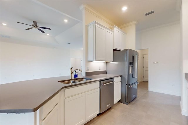 2545 Saint Lucia Cir, Vero Beach, FL 32967 - kitchen featuring stainless steel appliances, a sink, ceiling fan, crown molding, and white cabinetry