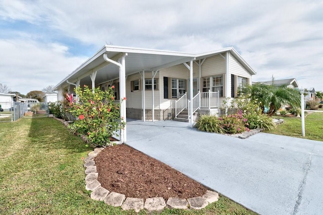 view of home's exterior with a carport and a lawn