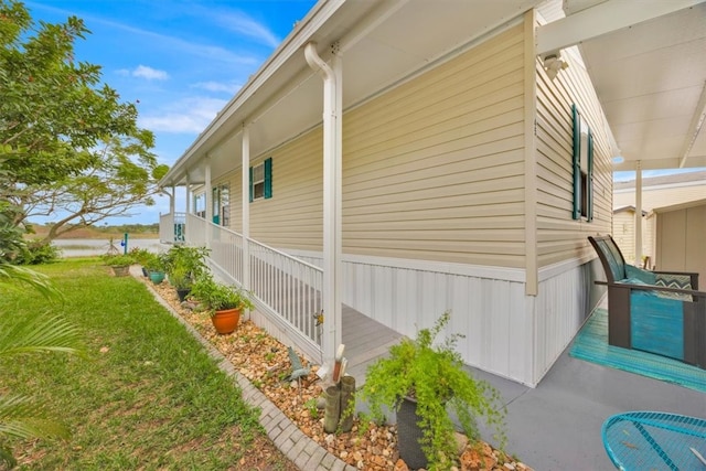 view of side of home featuring a yard