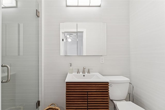 1786 Cypress Ln, Vero Beach, FL 32963 - bathroom with vanity, a stall shower, and tile walls