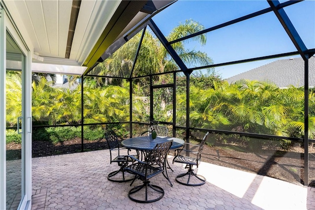 view of patio with glass enclosure