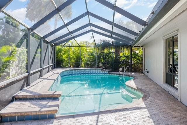 1786 Cypress Ln, Vero Beach, FL 32963 - outdoor pool featuring a lanai and a patio area