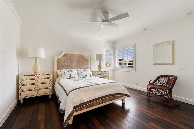 bedroom featuring dark wood-type flooring, ornamental molding, and ceiling fan