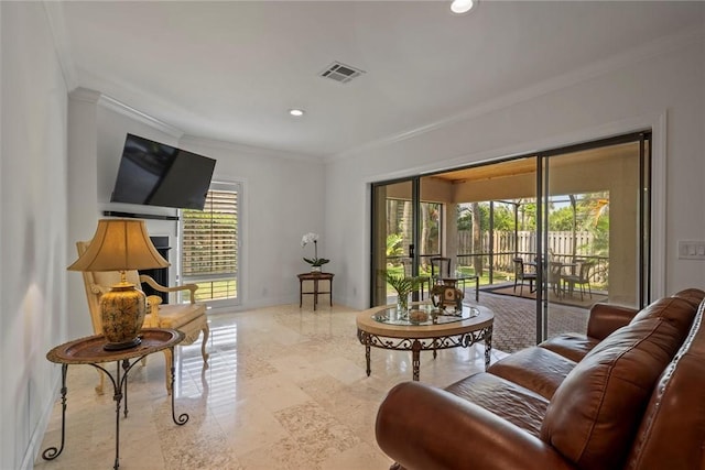 living room featuring crown molding