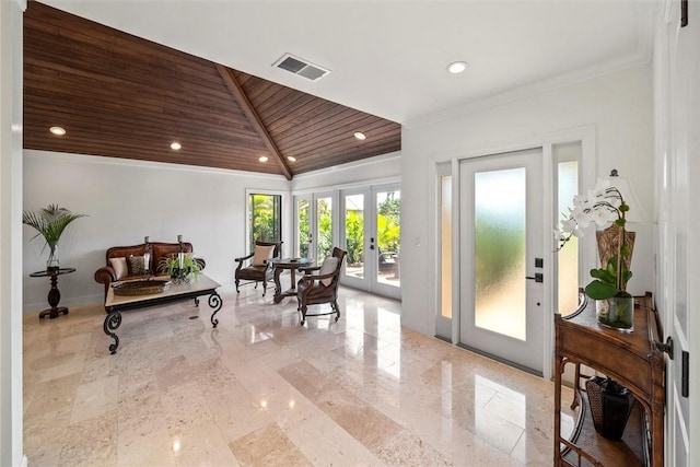 interior space featuring ornamental molding, vaulted ceiling, wood ceiling, and french doors