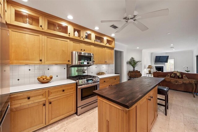 dining space featuring wooden ceiling, ceiling fan, and vaulted ceiling