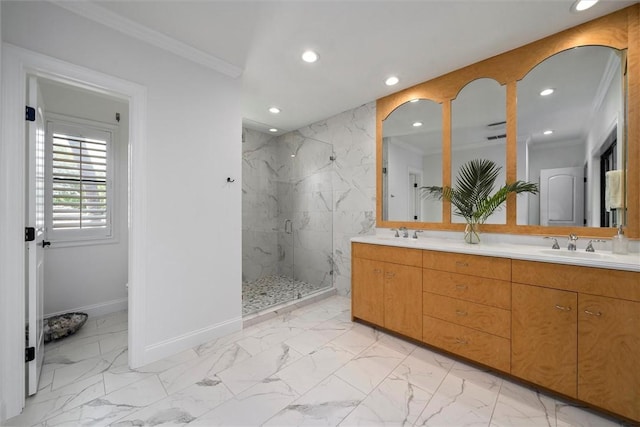 bathroom with crown molding, vanity, and a shower with shower door