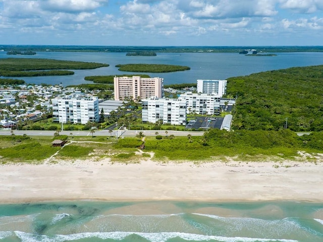 bird's eye view with a water view and a view of the beach