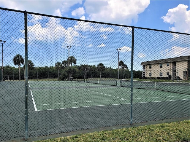 view of sport court with fence