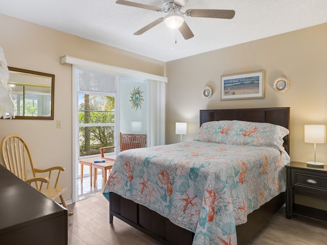 bedroom with ceiling fan and hardwood / wood-style flooring