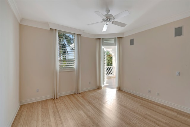 empty room with light wood-type flooring, ceiling fan, and crown molding