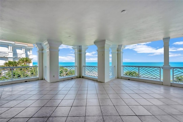 interior space featuring a water view and plenty of natural light