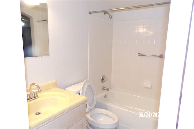 full bathroom featuring toilet,  shower combination, and vanity