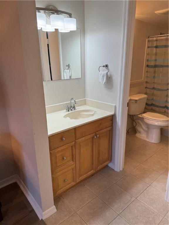 full bath featuring tile patterned floors, toilet, and vanity