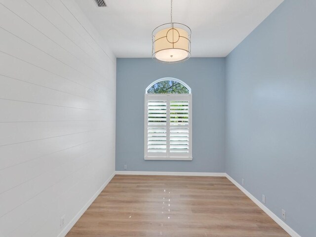 spare room featuring light hardwood / wood-style flooring