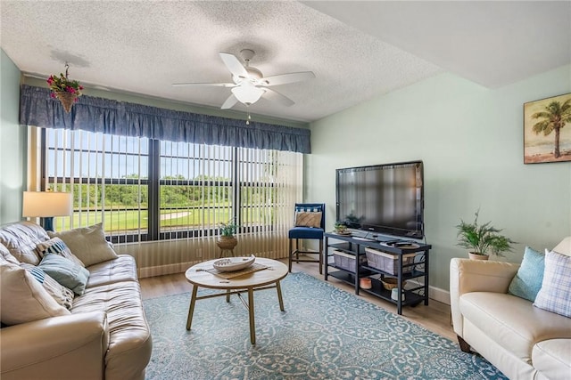 28 Plantation Dr Unit 204, Vero Beach, FL 32966 - living area with a ceiling fan, a textured ceiling, and wood finished floors