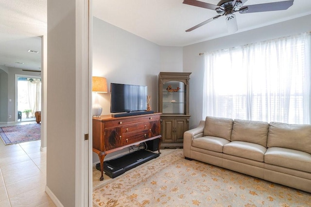 living room featuring ceiling fan and light tile patterned floors