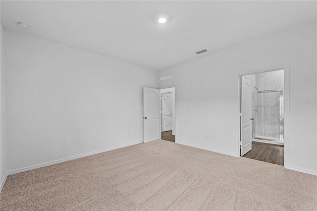 8715 98th Ct, Vero Beach, FL 32967 - unfurnished bedroom with dark carpet, baseboards, and recessed lighting