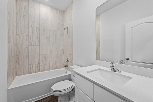 8715 98th Ct, Vero Beach, FL 32967 - bathroom featuring toilet, vanity, shower / washtub combination, and wood finished floors