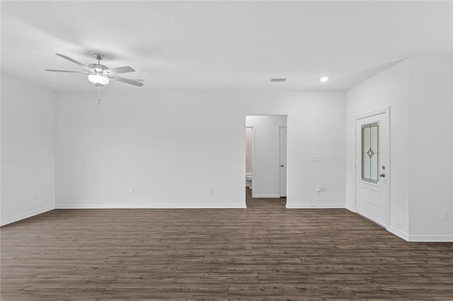 8715 98th Ct, Vero Beach, FL 32967 - empty room featuring dark wood-style flooring, a ceiling fan, baseboards, and recessed lighting