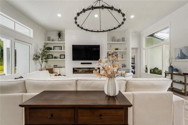 1411 E Camino Del Rio, Vero Beach, FL 32963 - living room featuring built in features, wood finished floors, ornamental molding, and recessed lighting