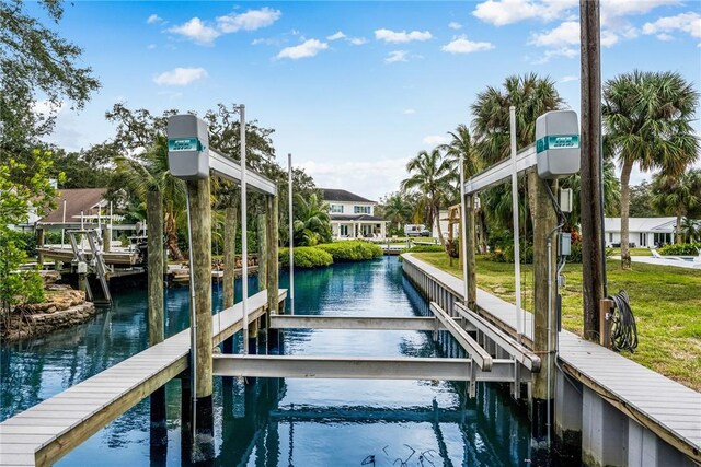 1411 E Camino Del Rio, Vero Beach, FL 32963 - view of dock with a water view and boat lift