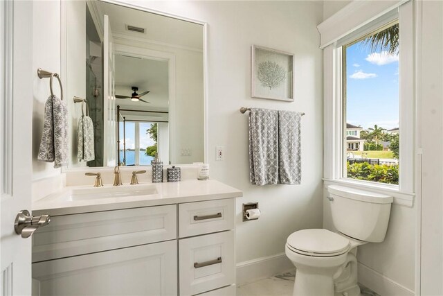 1411 E Camino Del Rio, Vero Beach, FL 32963 - bathroom with toilet, vanity, visible vents, a ceiling fan, and baseboards
