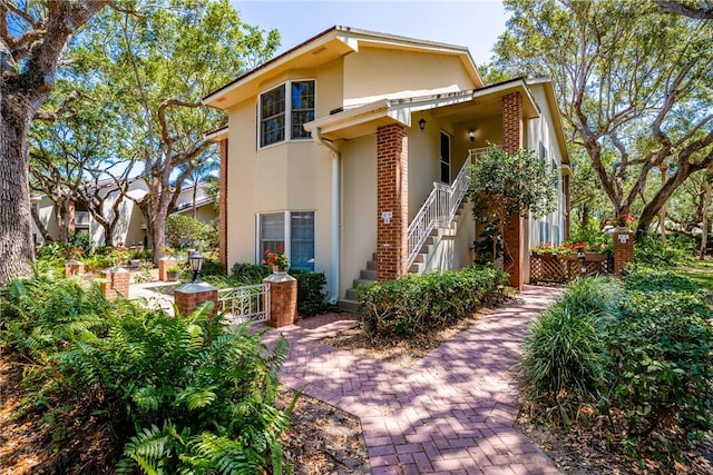 107 W Park Shores Cir Unit 28W, Vero Beach, FL 32963 - view of front of property with stucco siding and stairs