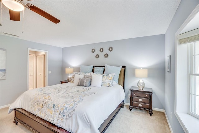 107 W Park Shores Cir Unit 28W, Vero Beach, FL 32963 - bedroom with light carpet and a ceiling fan