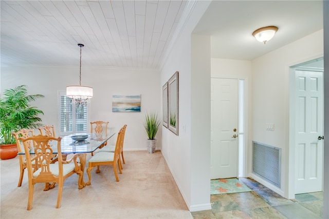 carpeted dining room with wooden ceiling, a notable chandelier, and crown molding