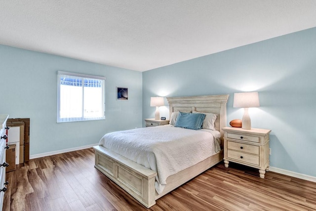 bedroom with wood-type flooring