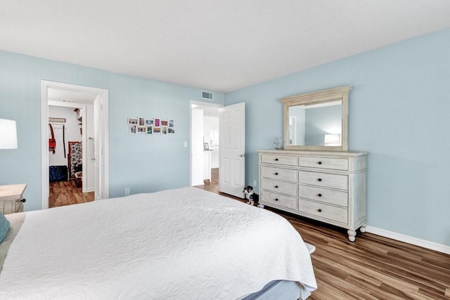 bedroom with wood-type flooring