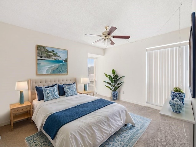 bedroom with light carpet, a textured ceiling, and ceiling fan