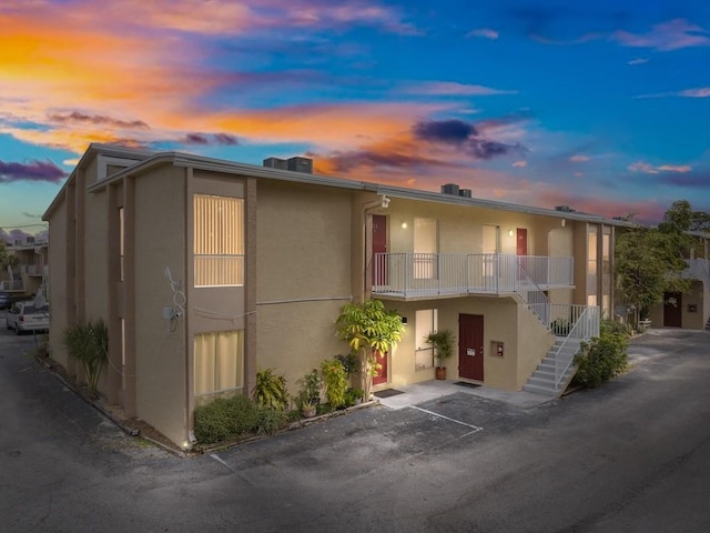 view of outdoor building at dusk