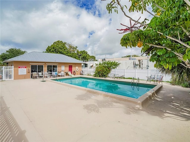 view of swimming pool with a patio