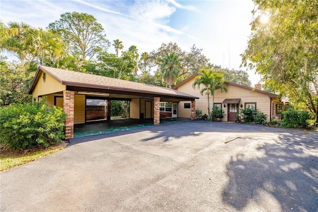 view of front of home with a carport