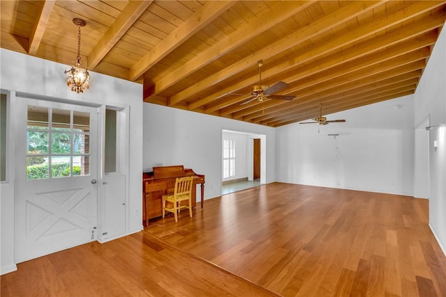 foyer entrance featuring lofted ceiling with beams, wood-type flooring, wood ceiling, and a chandelier