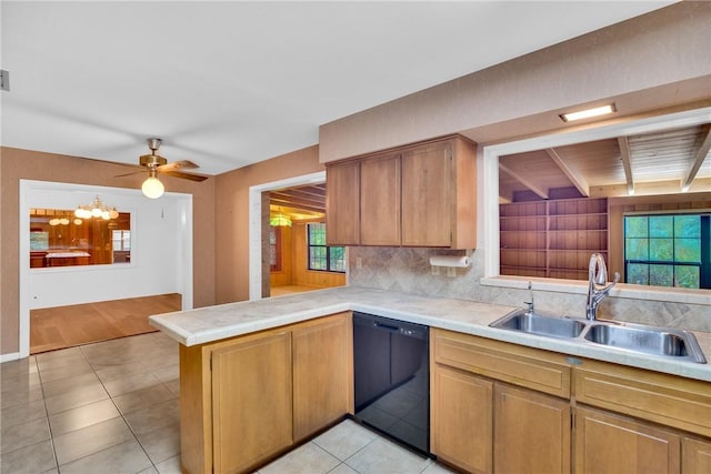 kitchen with ceiling fan, dishwasher, sink, kitchen peninsula, and light tile patterned flooring