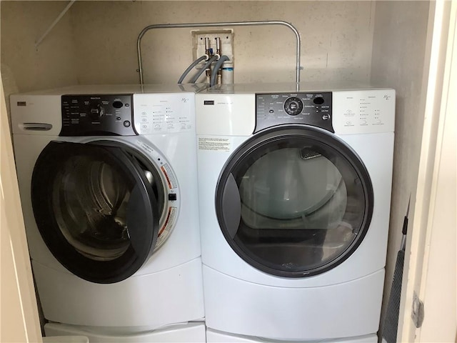 4 Vista Gardens Trl Unit 103, Vero Beach, FL 32962 - laundry area with washing machine and clothes dryer
