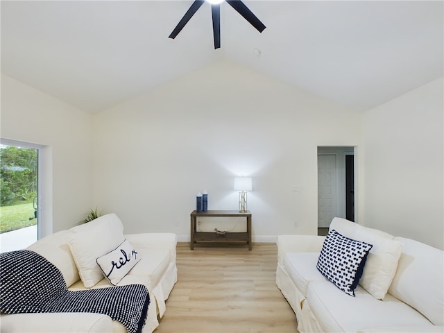 living room with ceiling fan, light wood-type flooring, and high vaulted ceiling